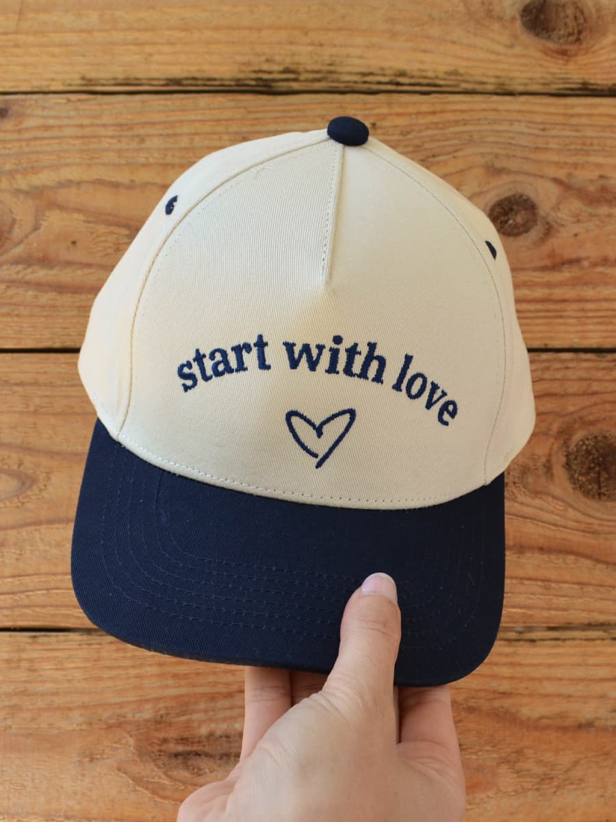 start with love Trucker Hat view 1