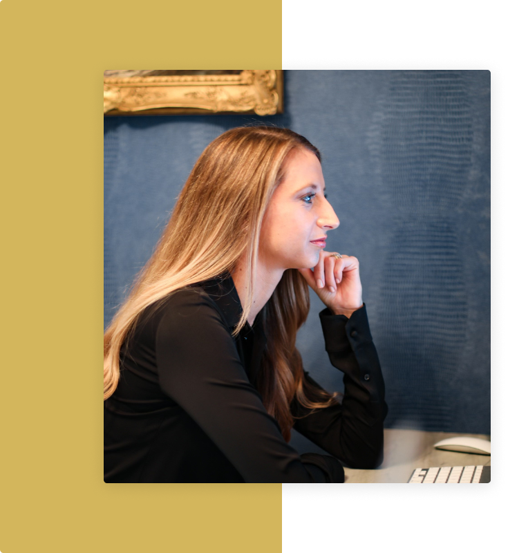 Dr. Ellen Reed working at her desk during a coaching session